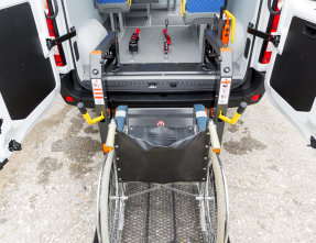 wheelchair in a medical transport van
